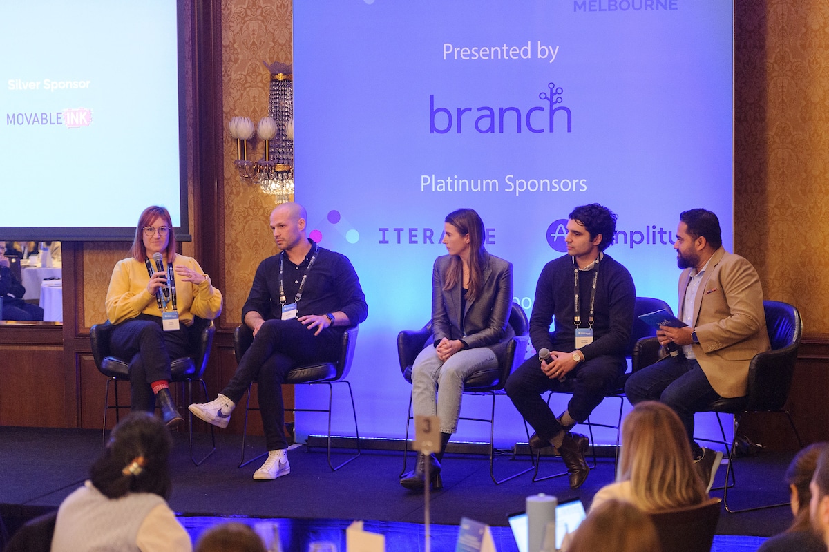 Photo of a panel discussion at the Leaders in Mobile Growth Melbourne event. The image shows speakers from Google, RACV, Flybuys, and SEEK. 